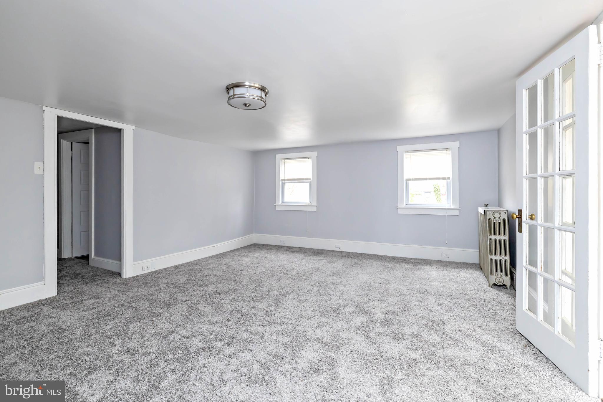 20 East Merchant Street, Unit C Audubon, NJ 08106 - Photo 10 of 26 an empty room with windows