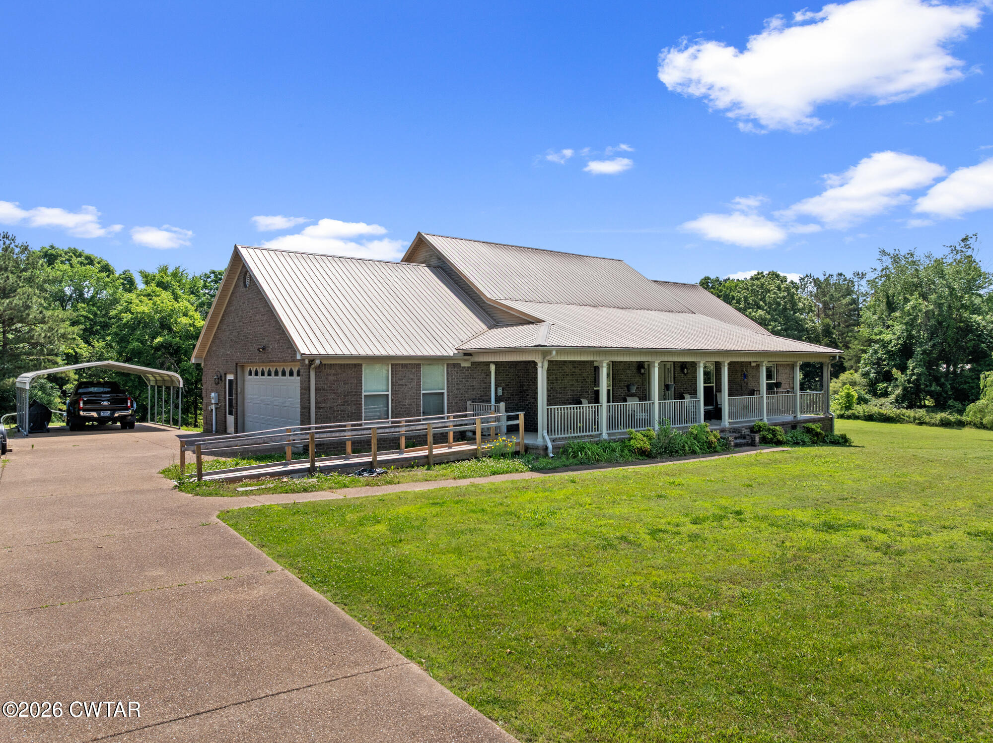 492 Joe Horton Road Lexington, TN 38351 - Photo 49 of 49 a front view of a house with swimming pool having outdoor seating