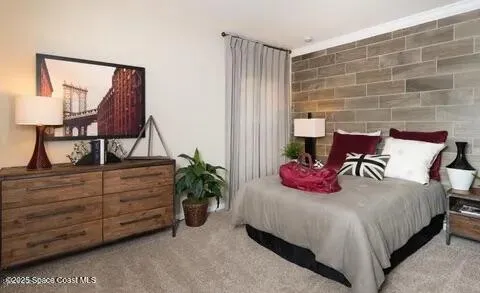 a bedroom with a bed and a potted plant