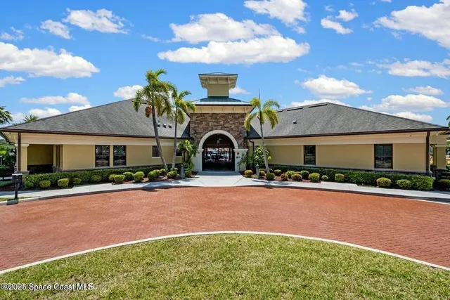 a front view of a house with yard and a garage