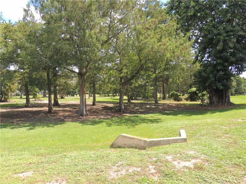 4112 Inverrary Drive, Unit 13F Lauderhill, FL 33319 - Photo 12 of 13 a view of yard with swimming pool and trees