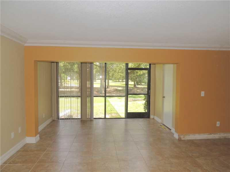 4112 Inverrary Drive, Unit 13F Lauderhill, FL 33319 - Photo 2 of 13 a view of an empty room with a window