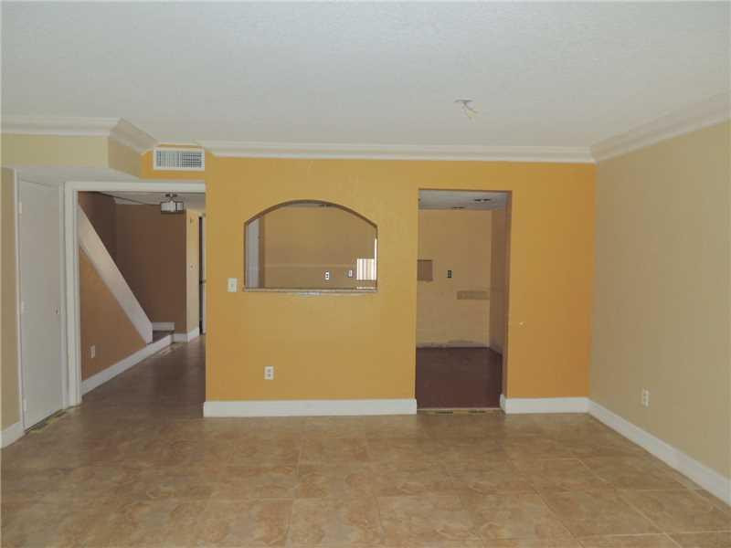 4112 Inverrary Drive, Unit 13F Lauderhill, FL 33319 - Photo 3 of 13 a view of a livingroom with wooden floor and staircase