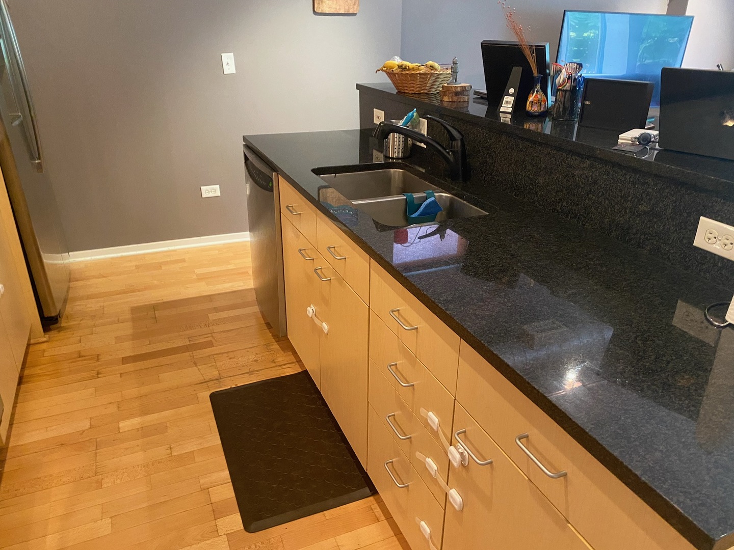 1640 Maple Avenue, Unit 203 Evanston, IL 60201 - Photo 5 of 10 a kitchen with granite countertop a sink and a stove