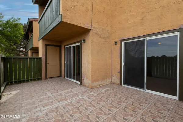 a view of outdoor space with sliding door and outdoor space