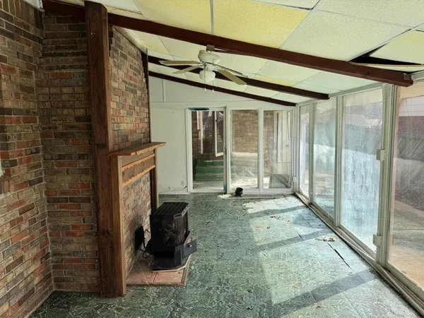 a view of a porch with a floor to ceiling window