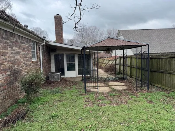 a house view with a garden space
