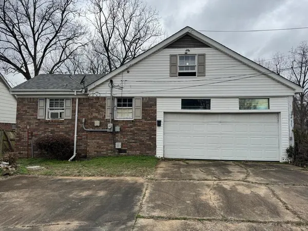a front view of a house with a garage