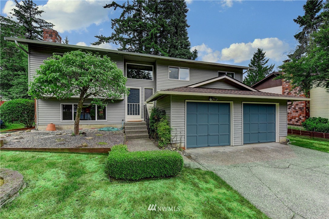21616 9th Avenue West Bothell, WA 98021 - Photo 1 of 21 a front view of a house with a yard and garage