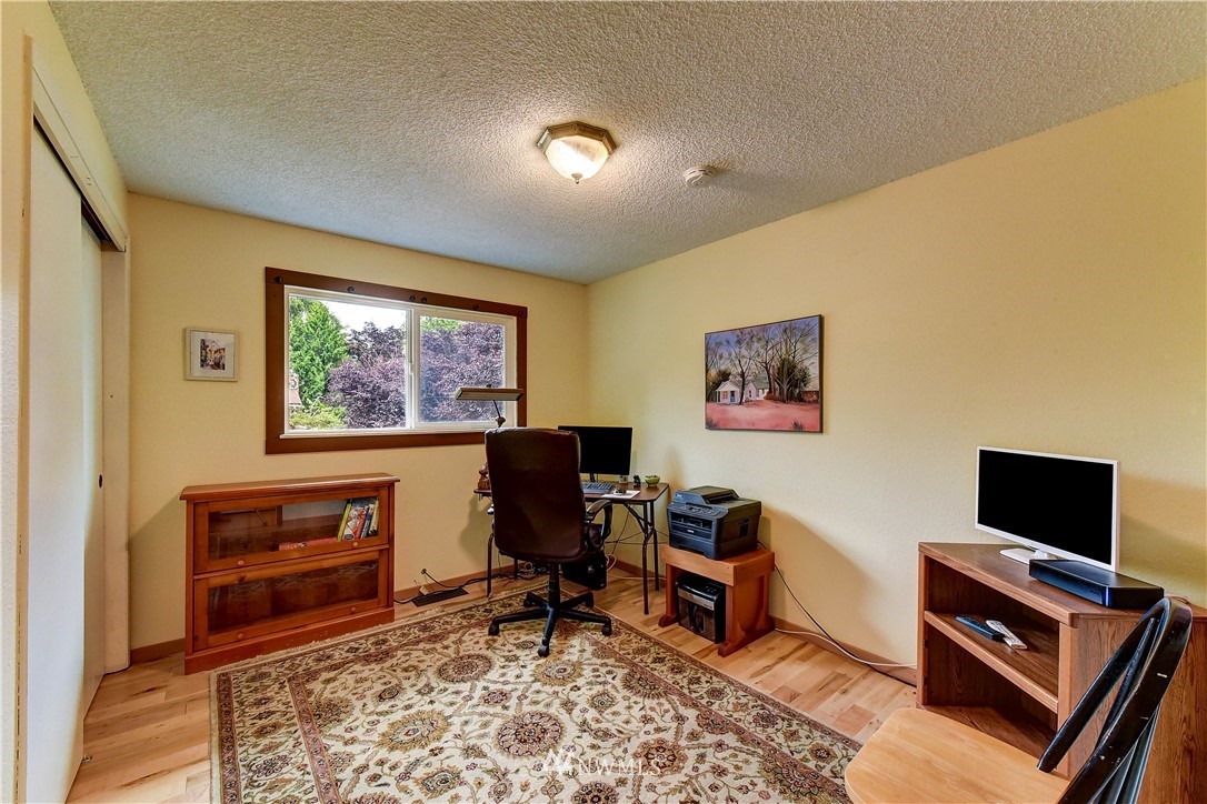 21616 9th Avenue West Bothell, WA 98021 - Photo 11 of 21 a living room with furniture and a flat screen tv