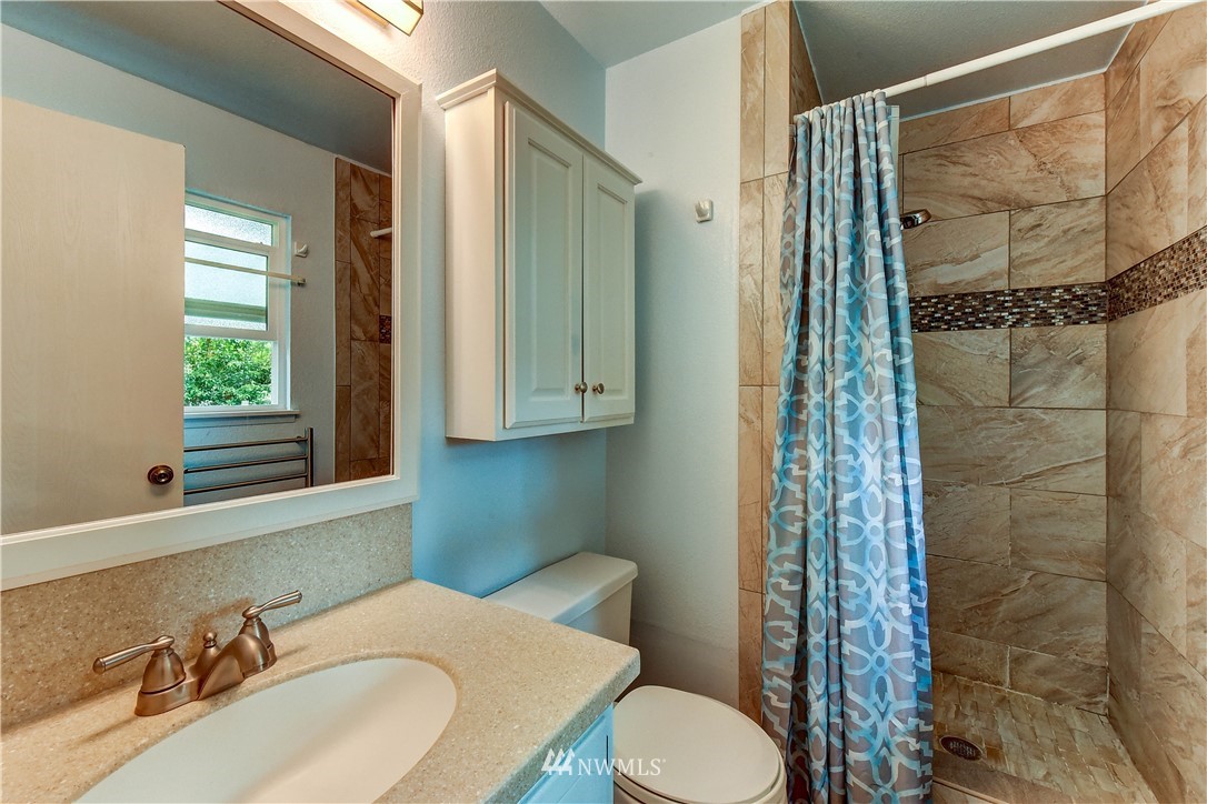 21616 9th Avenue West Bothell, WA 98021 - Photo 9 of 21 a bathroom with a sink toilet and shower