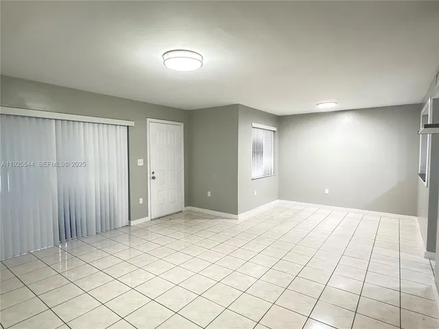 a view of an empty room and window