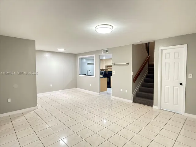 a view of a livingroom with a staircase