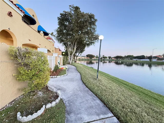 a view of a garden with a lake