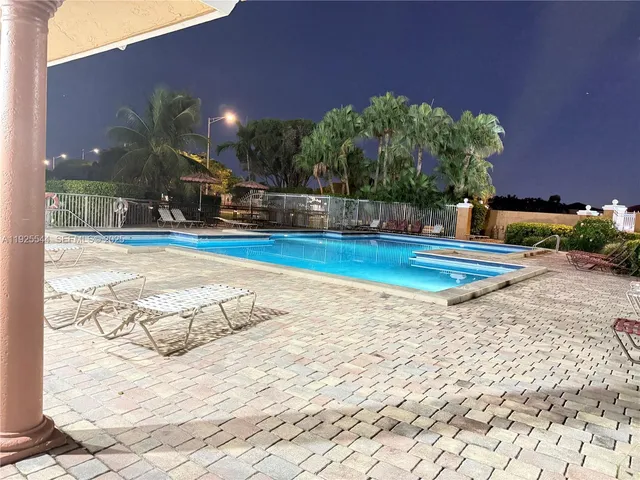 a view of a swimming pool with an outdoor space