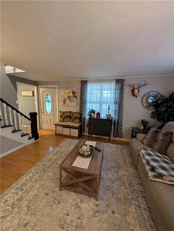 238 Hagentown Road Parker, PA 16049 - Photo 15 of 30 a living room with furniture and a dining table with rug
