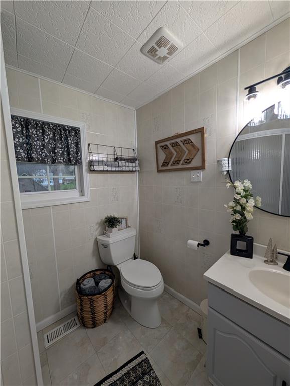238 Hagentown Road Parker, PA 16049 - Photo 18 of 30 a bathroom with a toilet a sink and a mirror