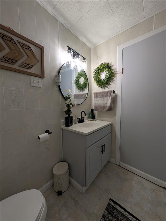 238 Hagentown Road Parker, PA 16049 - Photo 19 of 30 a bathroom with a toilet sink and mirror