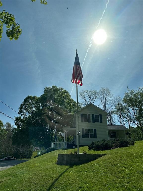 238 Hagentown Road Parker, PA 16049 - Photo 2 of 30 a front view of a house with garden