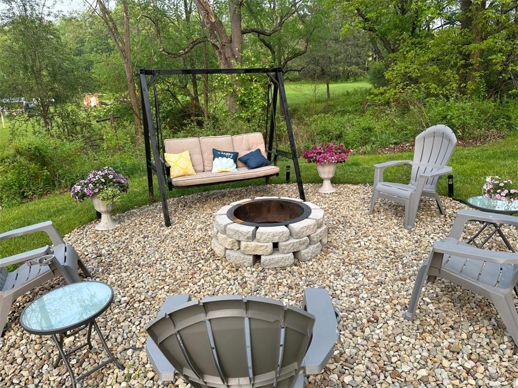 238 Hagentown Road Parker, PA 16049 - Photo 3 of 30 a backyard of a house with yard fountain and outdoor seating