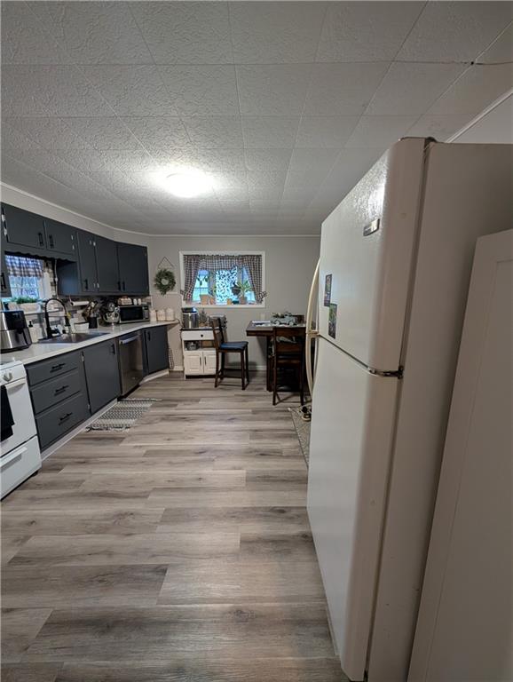 238 Hagentown Road Parker, PA 16049 - Photo 10 of 30 a kitchen with a refrigerator and a stove top oven