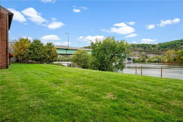 a view of a garden with a building in the background