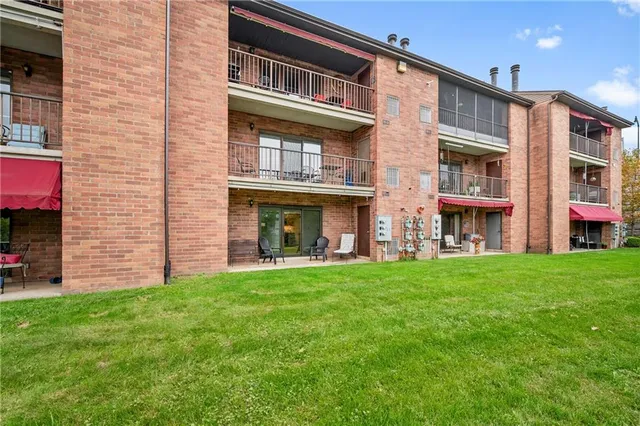 a view of an apartment with a garden