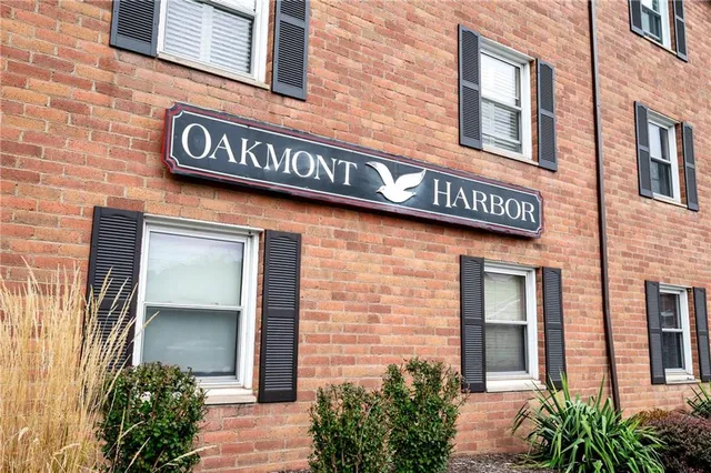 a view of a brick building with potted plants