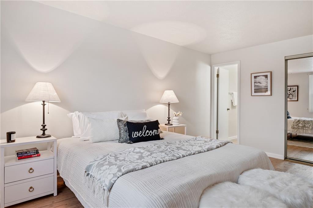 31 Huston Road Oakmont, PA 15139 - Photo 22 of 38 a bedroom with a bed and a chandelier