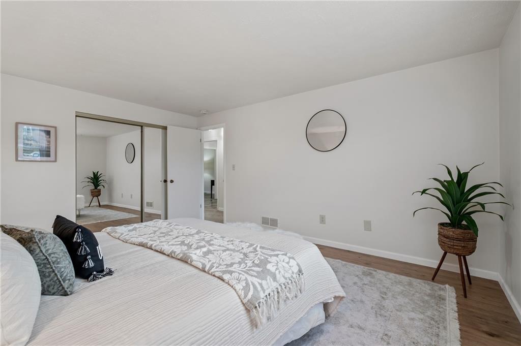 31 Huston Road Oakmont, PA 15139 - Photo 24 of 38 a bedroom with a bed and a potted plant