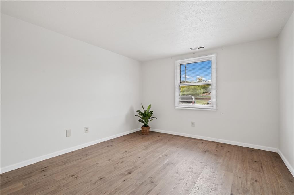 31 Huston Road Oakmont, PA 15139 - Photo 25 of 38 an empty room with wooden floor and windows