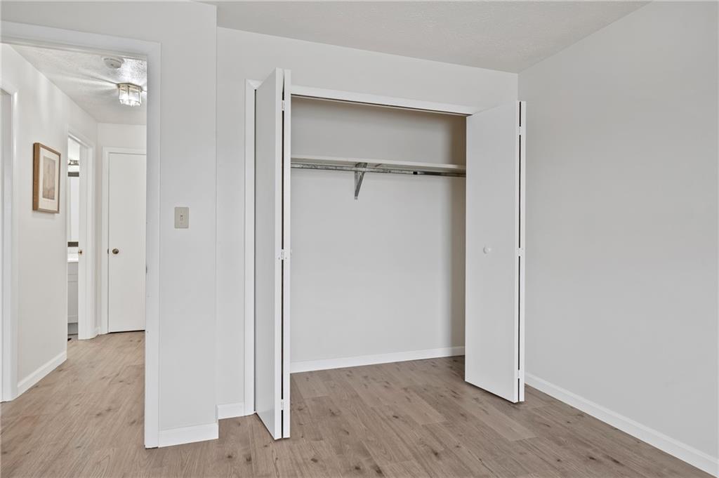 31 Huston Road Oakmont, PA 15139 - Photo 26 of 38 a view of an empty room with closet and wooden floor