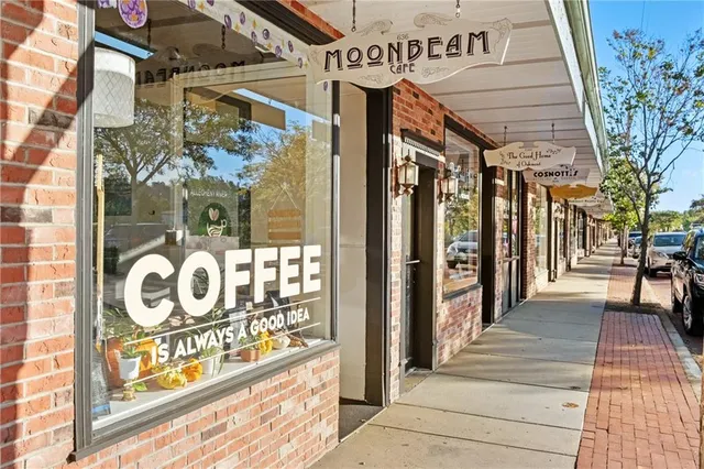 a view of a shop on the street