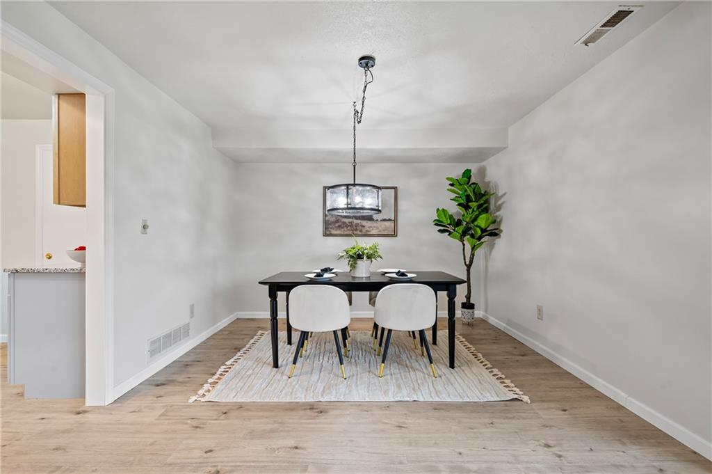 31 Huston Road Oakmont, PA 15139 - Photo 5 of 38 a view of a dining room with furniture window and wooden floor
