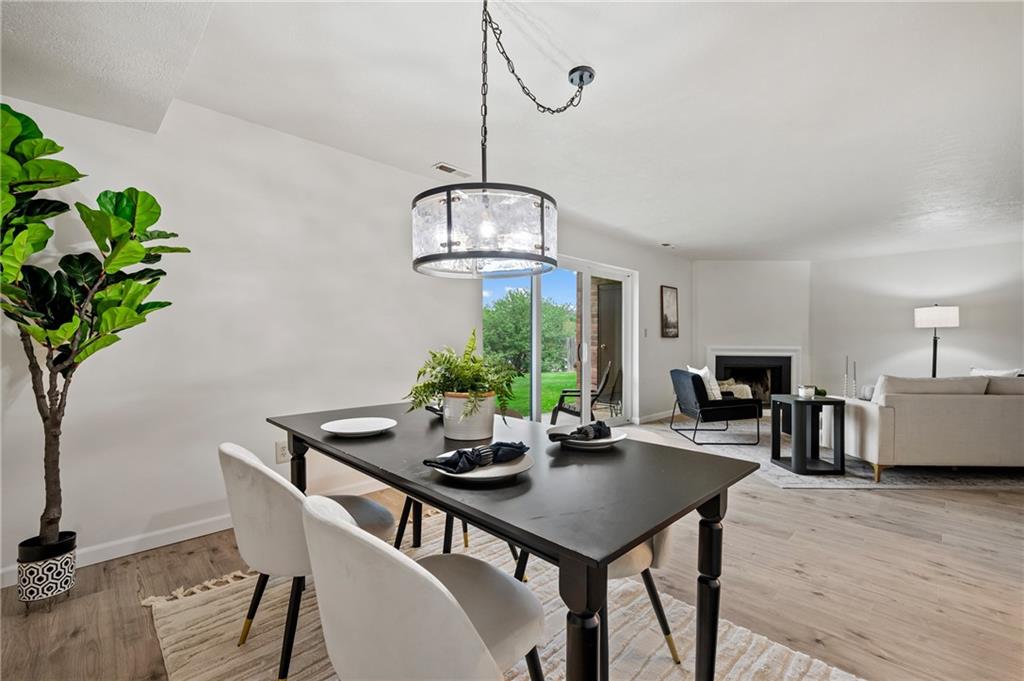 31 Huston Road Oakmont, PA 15139 - Photo 6 of 38 a view of a dining room with furniture window and wooden floor
