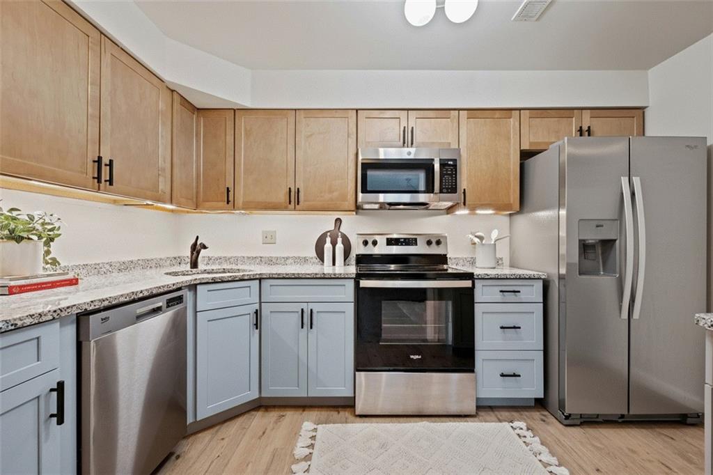 31 Huston Road Oakmont, PA 15139 - Photo 8 of 38 a kitchen with stainless steel appliances a stove microwave and refrigerator
