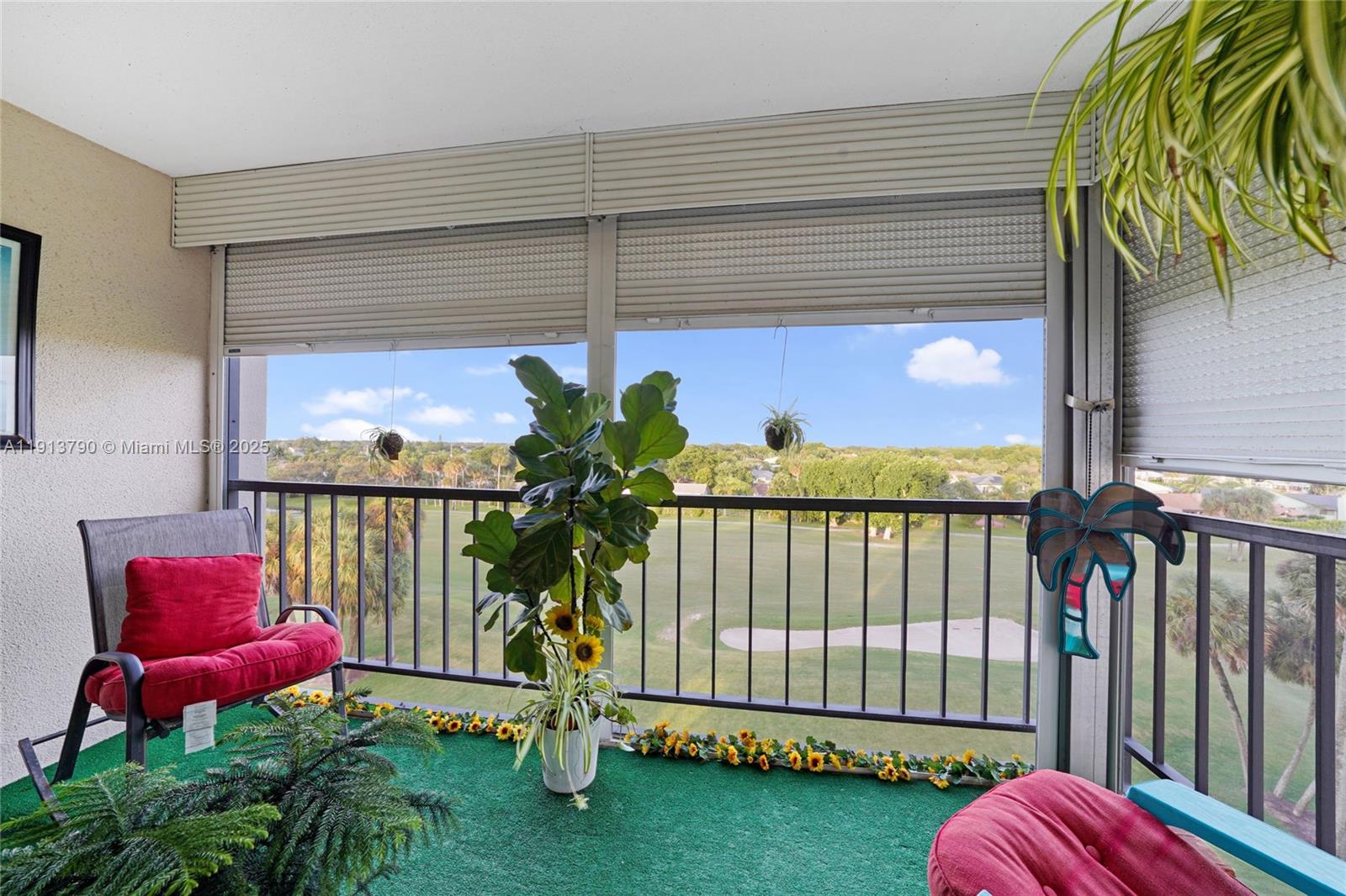 2430 DC Country Club Boulevard, Unit 6092 Deerfield Beach, FL 33442 - Photo 17 of 32 a view of a porch with a bench