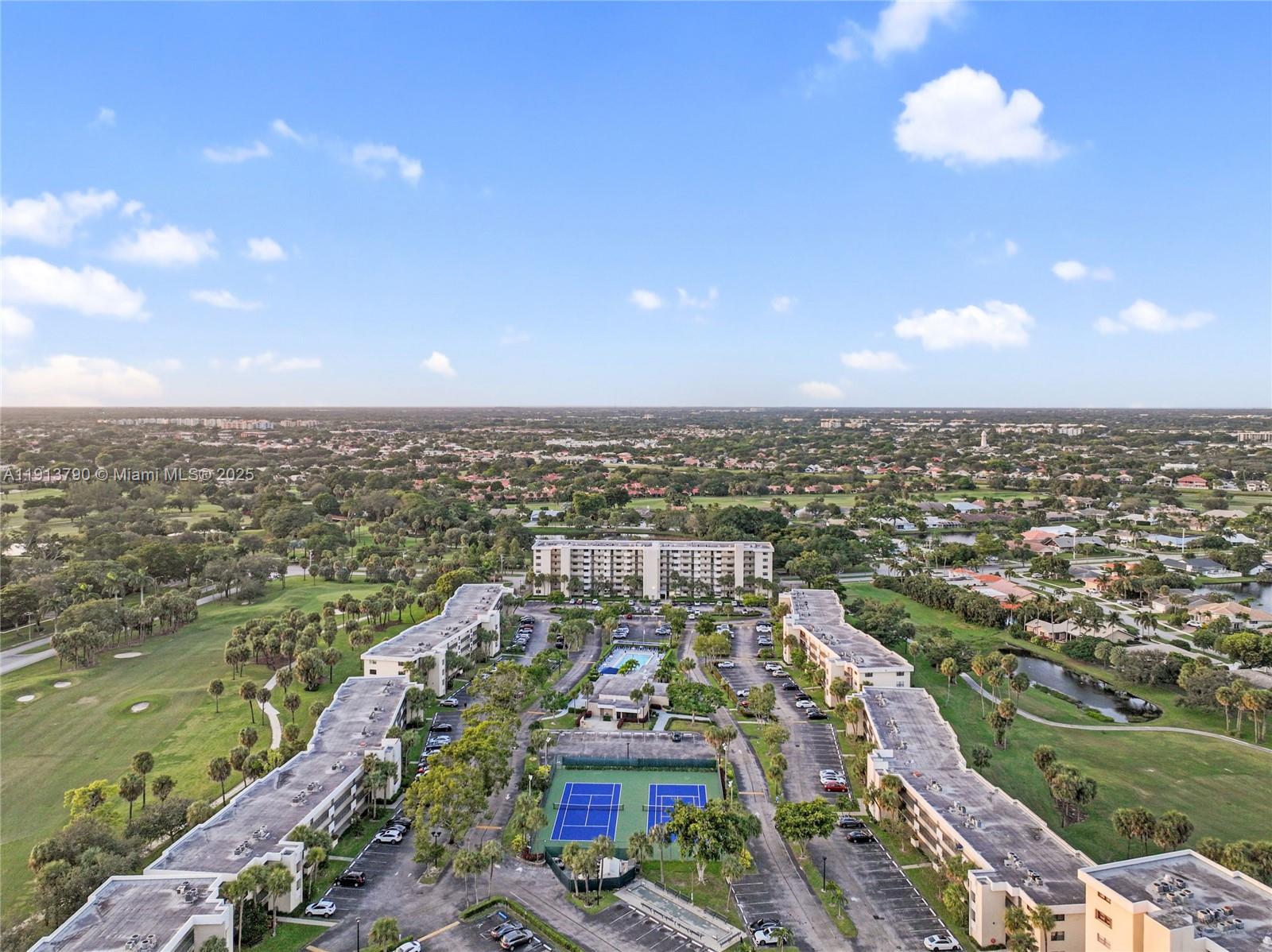 2430 DC Country Club Boulevard, Unit 6092 Deerfield Beach, FL 33442 - Photo 23 of 32 an aerial view of a city with lots of residential buildings