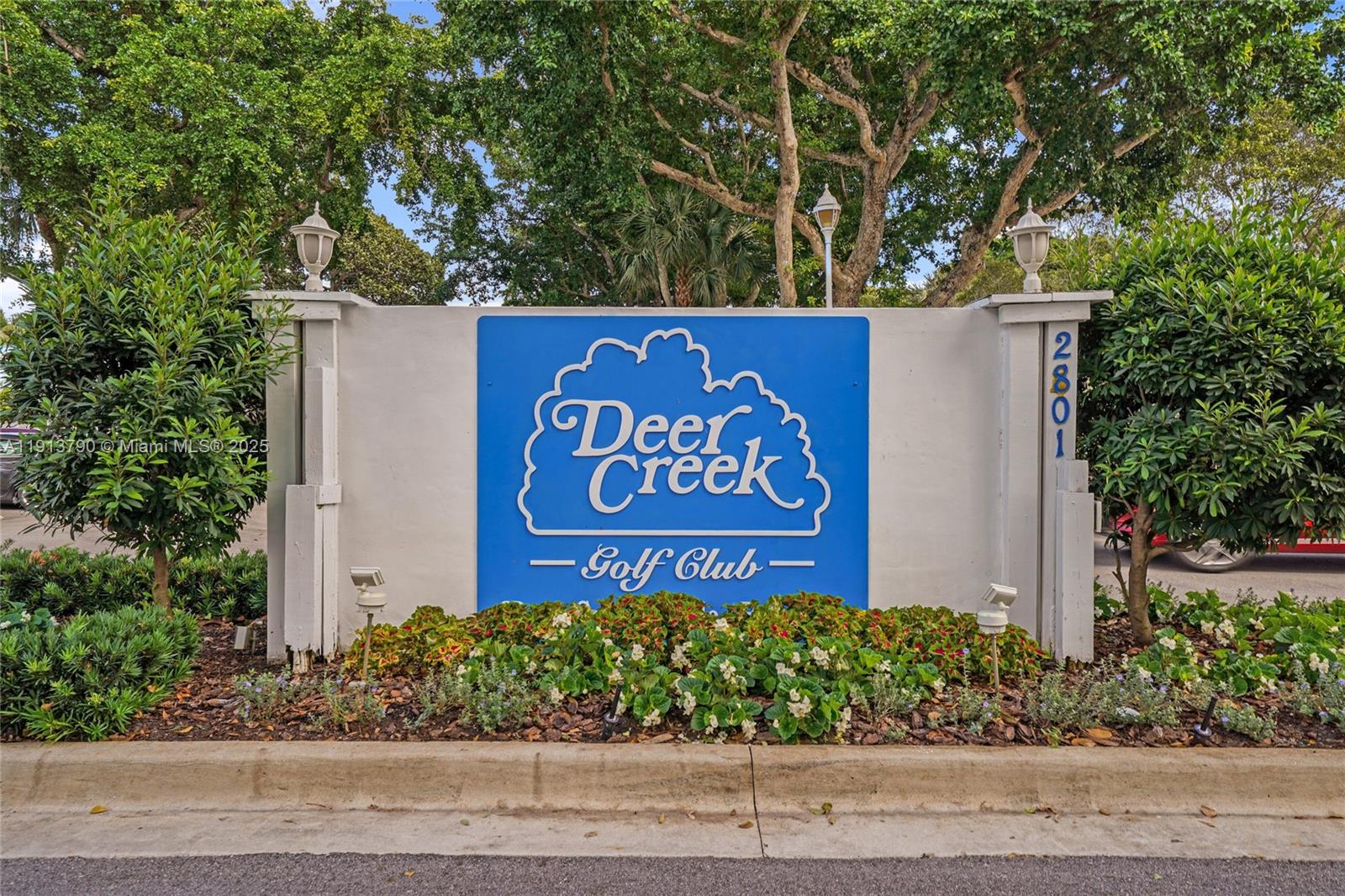 2430 DC Country Club Boulevard, Unit 6092 Deerfield Beach, FL 33442 - Photo 28 of 32 a sign on the side of a building