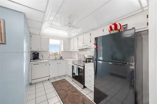 a kitchen with a stove and a refrigerator