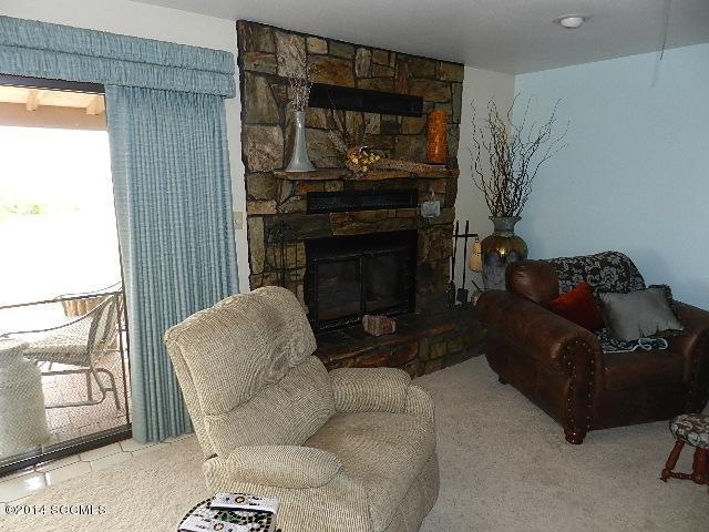 471 Camino Providencia Rio Rico, AZ 85648 - Photo 5 of 49 a living room with furniture and a fireplace