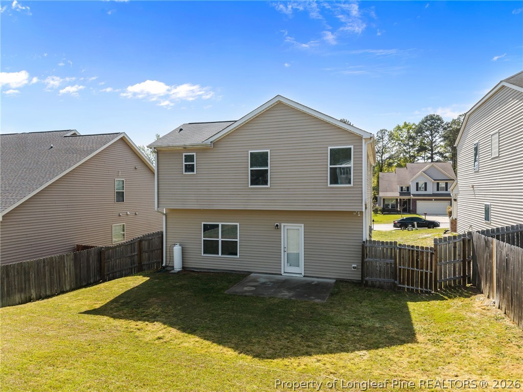 226 River Oak Street Spring Lake, NC 28390 - Photo 41 of 41 a view of a house with backyard and sitting area