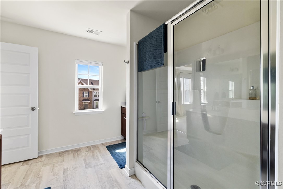 7817 Old Guild Road North Chesterfield, VA 23237 - Photo 18 of 44 Glass shower door stands overtop the LVP flooring
