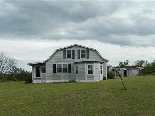 426 Montfort Road Butler, GA 31006 - Photo 1 of 1 a view of a house with a backyard