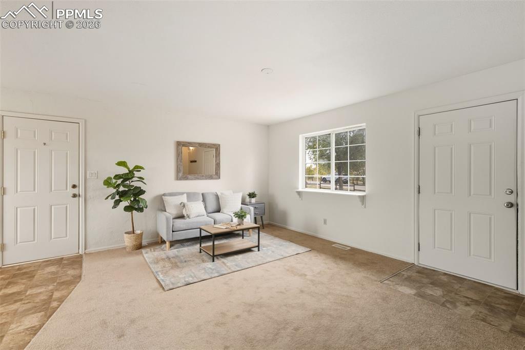 9430 Bar B Road Fountain, CO 80817 - Photo 12 of 43 a living room with furniture and a potted plant