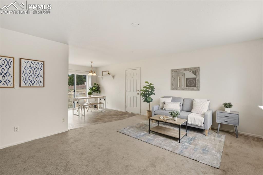 9430 Bar B Road Fountain, CO 80817 - Photo 15 of 43 a living room with furniture and a table