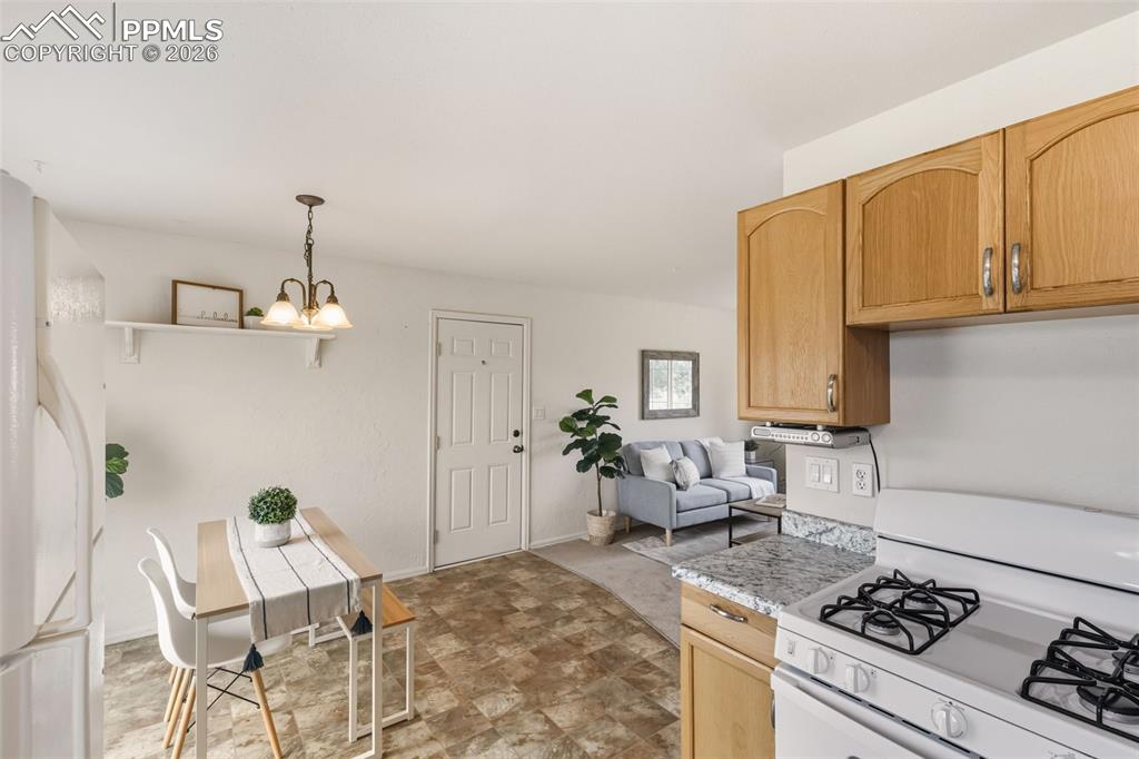 9430 Bar B Road Fountain, CO 80817 - Photo 19 of 43 a bedroom with furniture and a stove