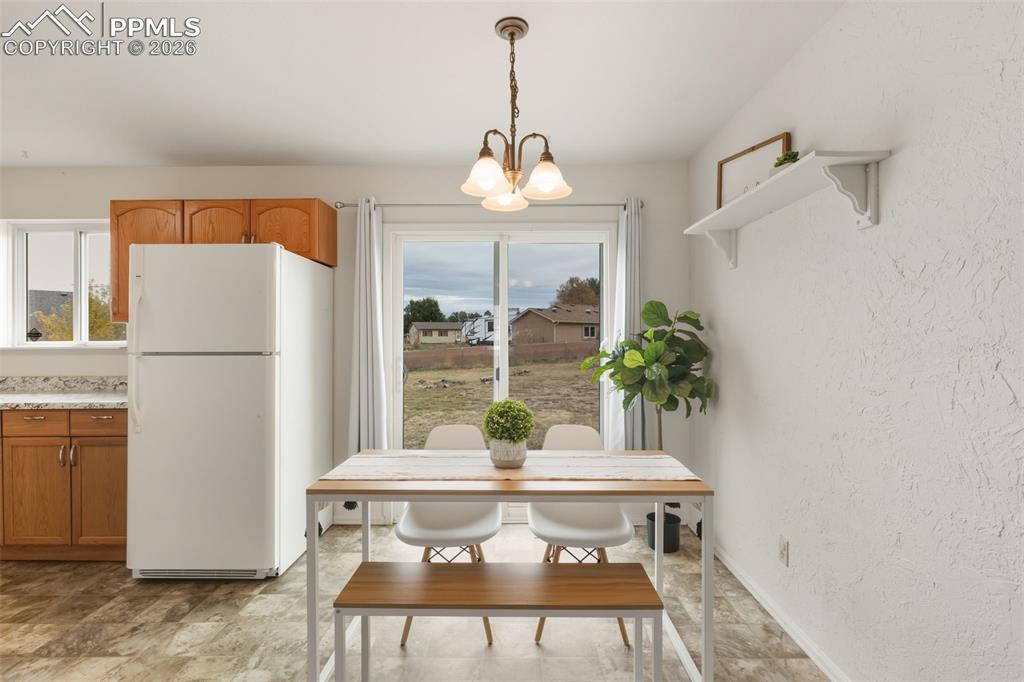 9430 Bar B Road Fountain, CO 80817 - Photo 20 of 43 a view of kitchen with furniture and a refrigerator