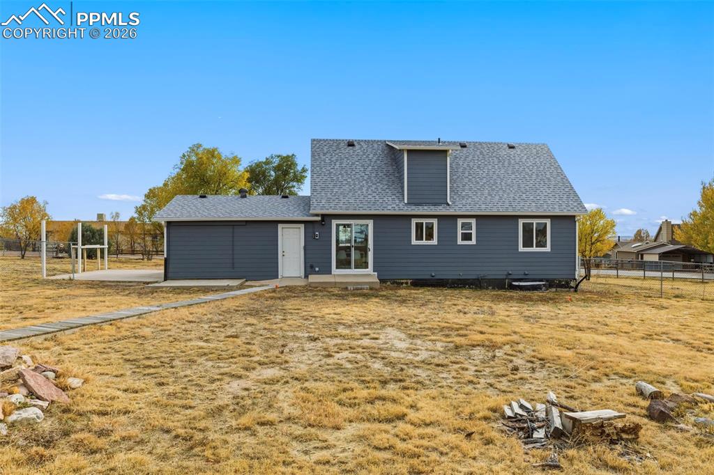 9430 Bar B Road Fountain, CO 80817 - Photo 2 of 43 a house with yard in front of it