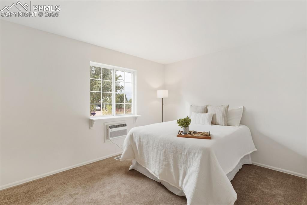 9430 Bar B Road Fountain, CO 80817 - Photo 22 of 43 a bedroom with a bed and a window